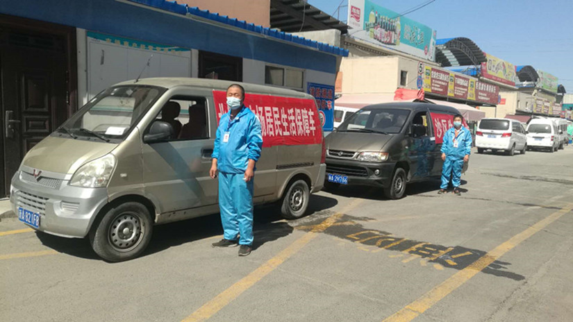 圖為：副食市場居民生活保障供應(yīng)車輛_副本.jpg